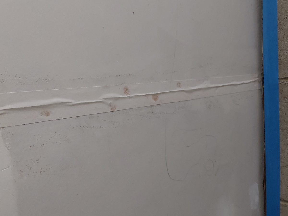 Bubbling drywall tape identified on a ceiling seam