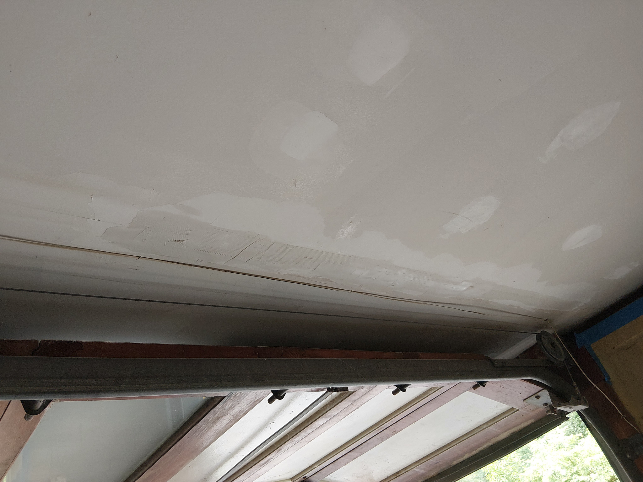Failed drywall tape removed and seam reinforced with mesh tape and setting-type joint compound